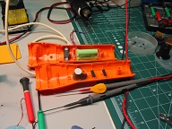 Shows supplied 3 pack 2/3AA NiMH battery pack and built up stand-off for pressure to back of upgraded switch.